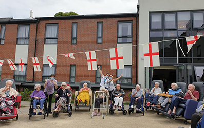 Team and Residents with England Bunting