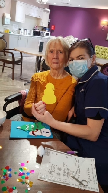 A resident doing Christmas crafts at Amberley Care Home