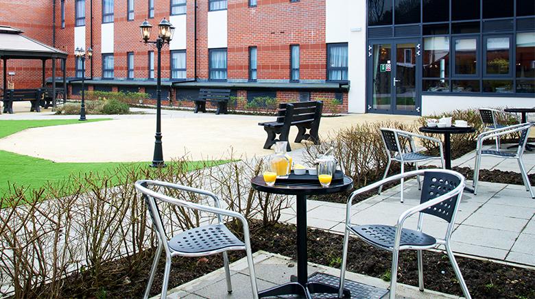 our garden with table and patio behind