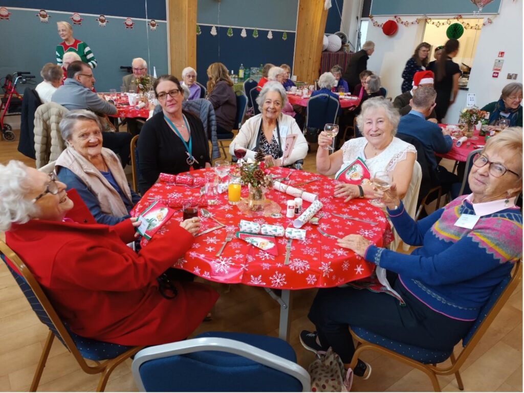 residents sat together eating lunch