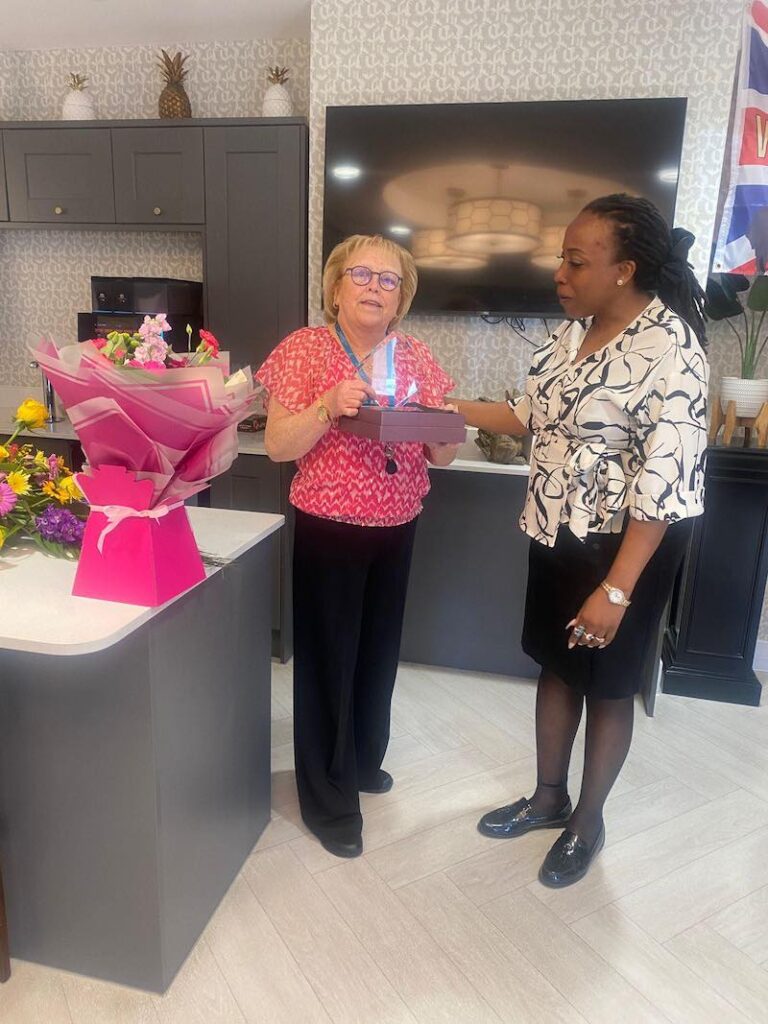 one of our team members being awarded employee of the month