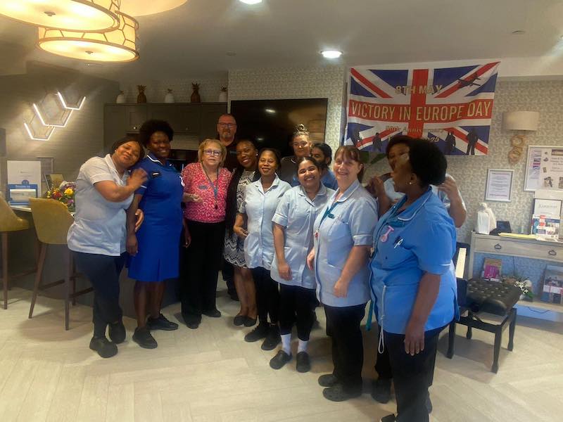 a group photo of our team on VE day