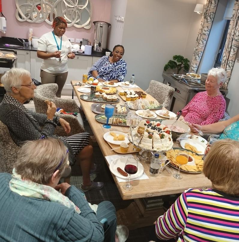 residents sat together enjoying lunch