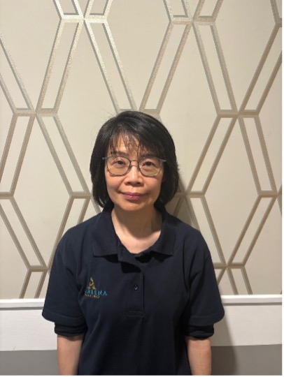 lady wearing glasses posing for staff photo
