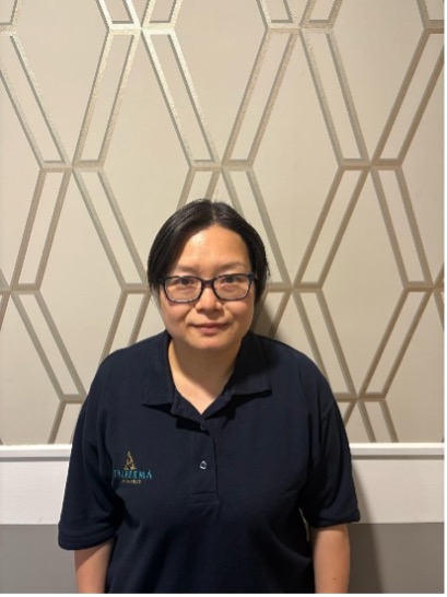 lady wearing glasses posing for staff photo