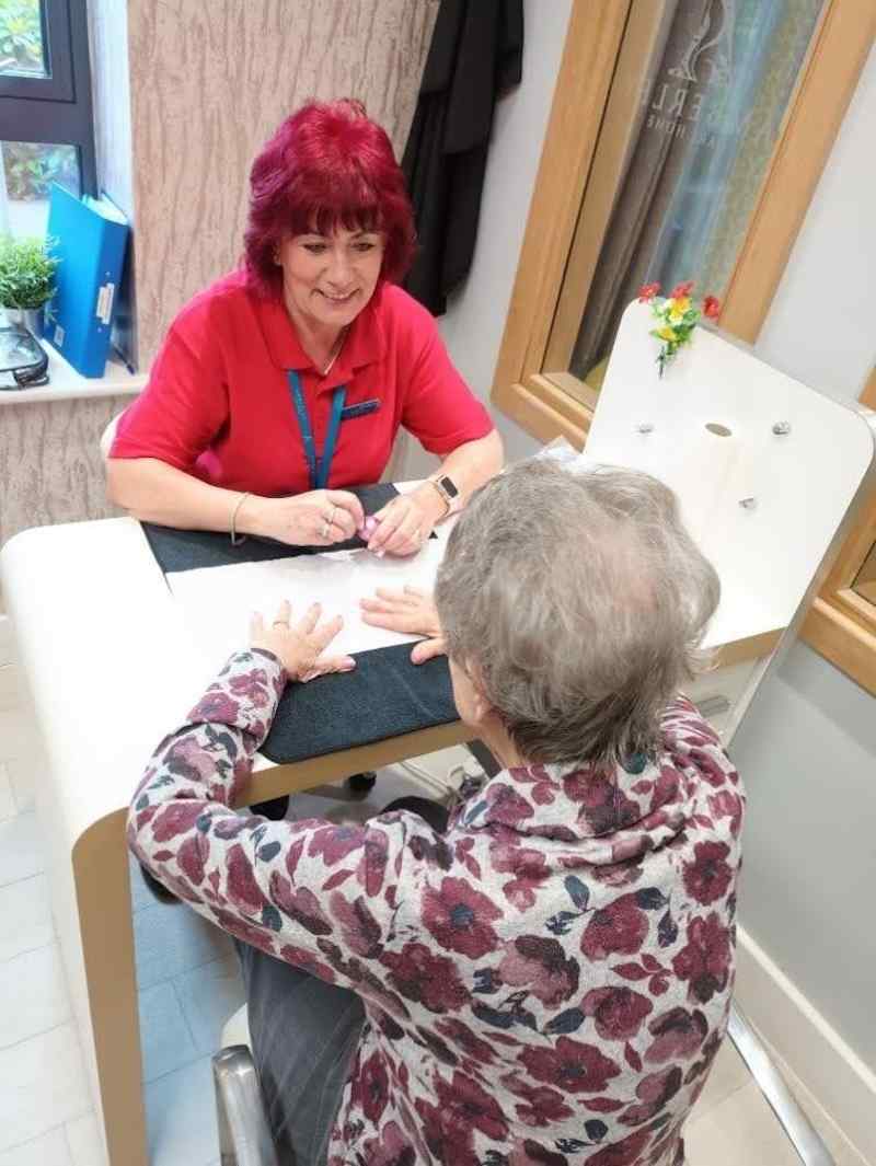 resident sat opposite our beautician having her nails done in the salon