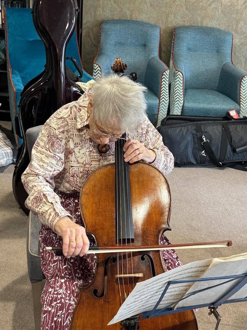 older lady playing the cello