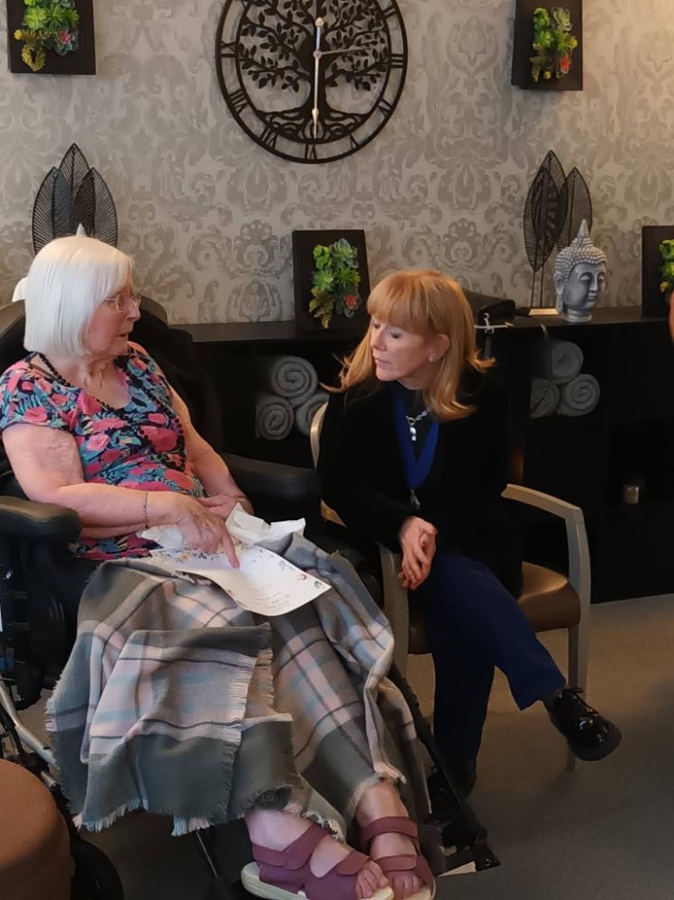 resident sat with a lady