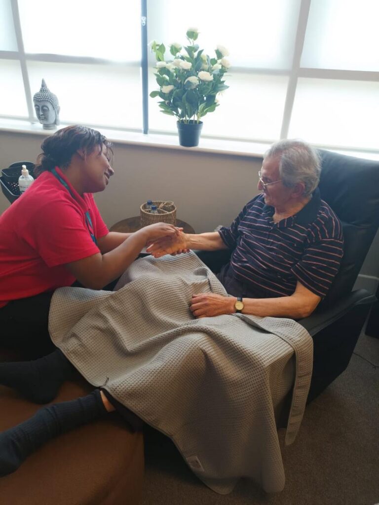 staff member doing a sensory activity with a resident