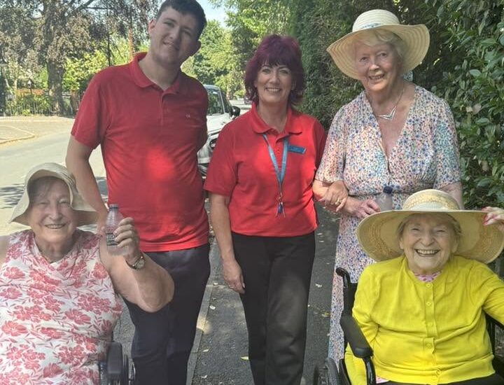 residents and outside in wheelchairs with staff